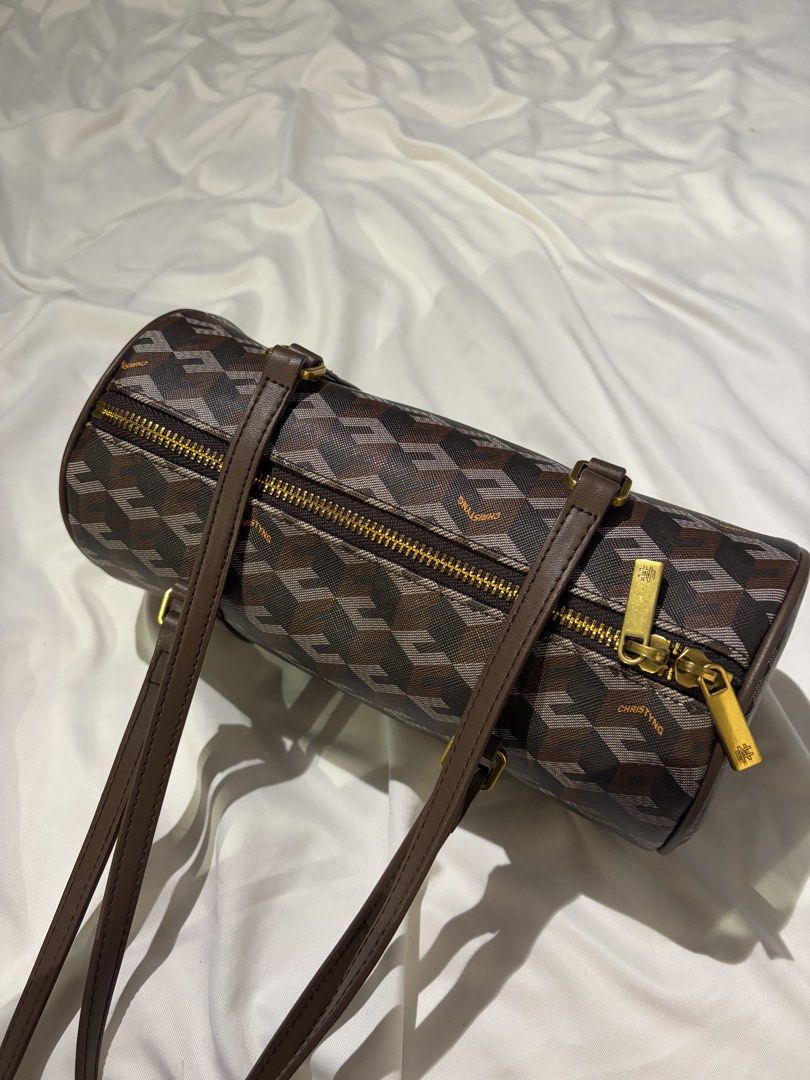 CHRISTYNG Monogram Barrel Bag (Category: Luxury Bags & Wallets) located in Balanga. Submitted by Janiamrz (Listing ID 1463014600, Image 1). Description: - Monogram barrel bag - Brown leather trim - Gold hardware - Zipper closure - Repeating geometric design - Two top handles - Great for everyday use.