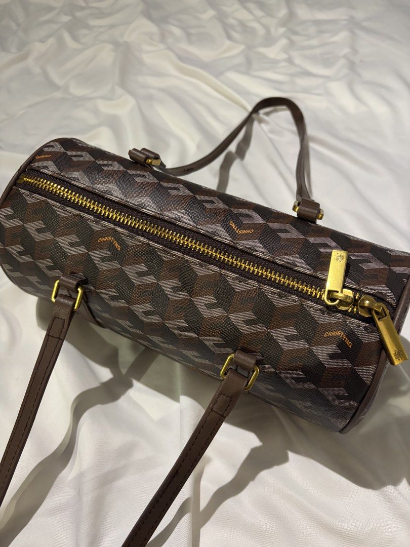 CHRISTYNG Monogram Barrel Bag (Category: Luxury Bags & Wallets) located in Balanga. Submitted by Janiamrz (Listing ID 1463014600, Image 2). Description: - Monogram barrel bag - Brown leather trim - Gold hardware - Zipper closure - Repeating geometric design - Two top handles - Great for everyday use.