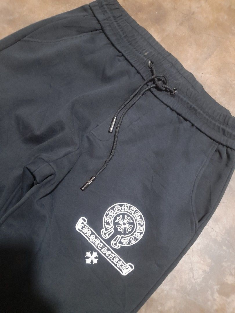 Chrome Hearts Black Joggers Sweatpants (Category: Joggers) located in Taguig. Submitted by sebas_tian (Listing ID 1463030304, Image 3). Description: - Brand: Chrome Hearts (OFF only) - Color: Black - Design: Iconic cross logo on front and back - Features: Elastic waistband with drawstring, ribbed cuffs with button details - Style: Comfortable and stylish for everyday wear.