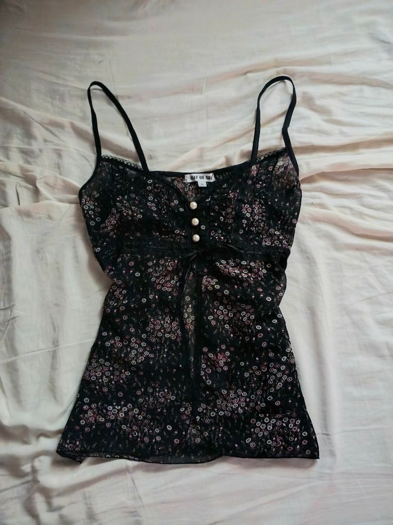 clef de sol vintage floral cami top (Category: Sleeveless) located in Iba. Submitted by fewiclo (Listing ID 1462899731, Image 1). Description: - Cute black camisole top - Delicate floral print - Lace trim along neckline - Three pearl-like buttons down the front - Lightweight and flowy material - Perfect for layering or wearing solo.