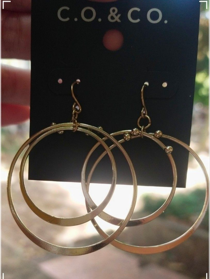C.O. & CO. Gold Double Hoop Earrings (Category: Earrings) located in Bacolod City. Submitted by jewels.of.joy (Listing ID 1462992734, Image 3). Description: - Gold double hoop earrings from C.O. & CO. - Features two nested hoops with small bead details. - Lightweight and stylish. - Great for everyday wear or dressing up an outfit. - Perfect for adding a bit of shine..