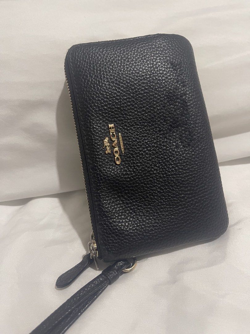 Coach double zip wrislet (Category: Wallets & Card holders) located in Naga. Submitted by luxx_clover (Listing ID 1463030191, Image 1). Description: Visible signs of use : - front (bubbles) nadikitan ng mainit - one leather puller (torn) - wristlet letter (rubs) .