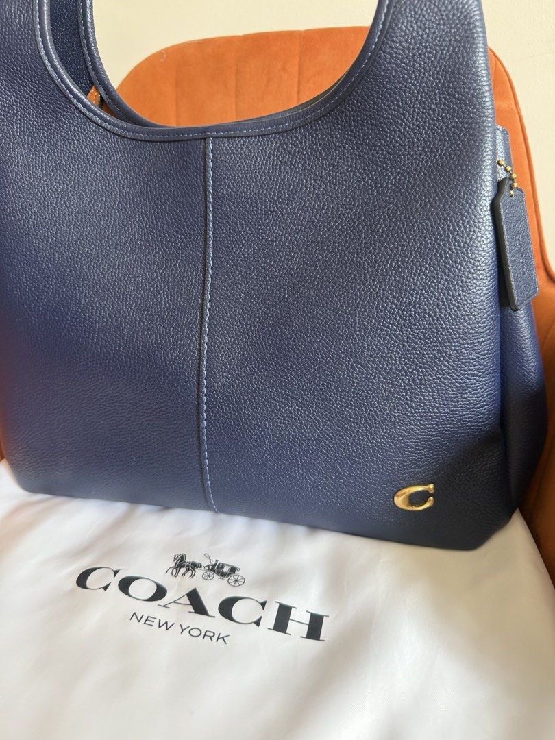 Coach Lana Navy Pebbled Leather Shoulder Bag (Category: Luxury Bags & Wallets) located in Muntinlupa City. Submitted by melaniegt (Listing ID 1462897500, Image 2). Description: - Original Coach Lana shoulder bag bought in Singapore for 36k - slightly used - very spacious and great everyday bag - can fit macbook laptop (see photo 6 and 7) - with very slight scratches (see photos 8 and 9) - slightly negotiable For pickup in Alabang .