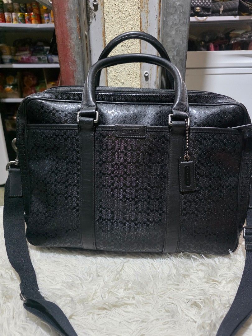 Coach Monogram Briefcase Bag (Category: Briefcases) located in Lemery. Submitted by venus23 (Listing ID 1463010464, Image 1). Description: - Coach monogram briefcase - Features top handles and a detachable shoulder strap - Ample interior space for work essentials - Smooth-gliding zippers - Clean and well-maintained interior - Ideal for daily work use or travel.