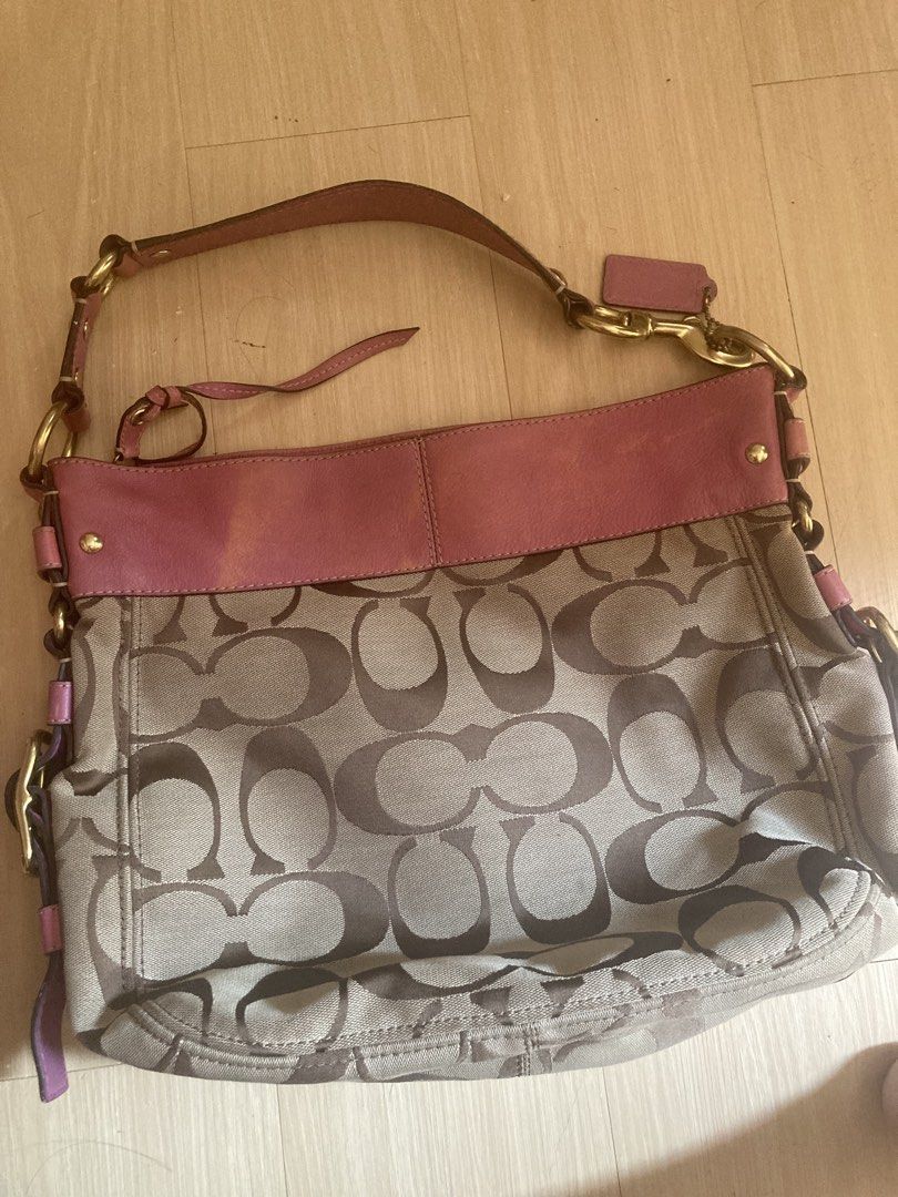 Coach Monogram Canvas & Pink Leather Shoulder Bag (Category: Luxury Bags & Wallets) located in Manila. Submitted by cesssssyyyyyyyy (Listing ID 1462935022, Image 1). Description: large zoe hobo bag issue lang is medyo faded yung ibang parts.