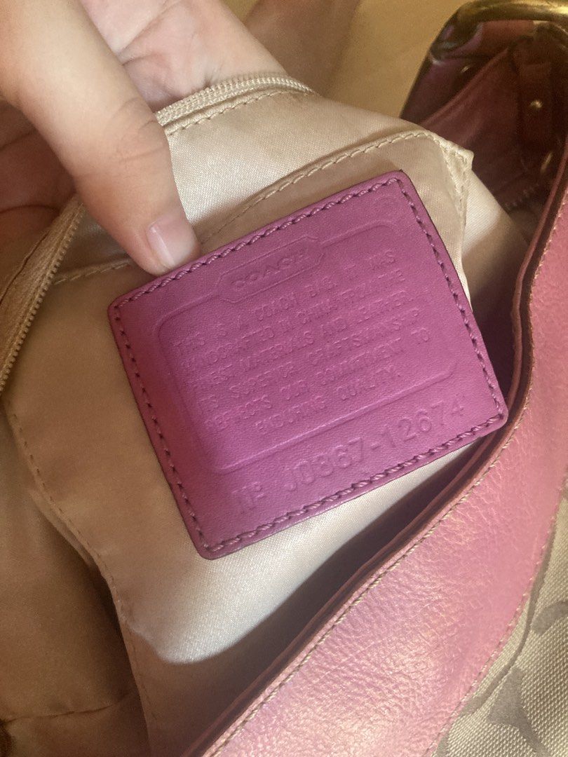 Coach Monogram Canvas & Pink Leather Shoulder Bag (Category: Luxury Bags & Wallets) located in Manila. Submitted by cesssssyyyyyyyy (Listing ID 1462935022, Image 3). Description: large zoe hobo bag issue lang is medyo faded yung ibang parts.