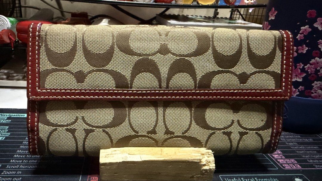 Coach Signature C turnlock long wallet (Category: Wallets & Card holders) located in Taytay. Submitted by jp4_fashion_hub (Listing ID 1462889679, Image 2). Description: vintage Coach Signature C turnlock long wallet 19.5cm x 9.5cm x 2cm Combination of canvass and patent leather Hardware scratches Silver hardware No rubs Signs of usage Manage expectations Made in Vietnam.