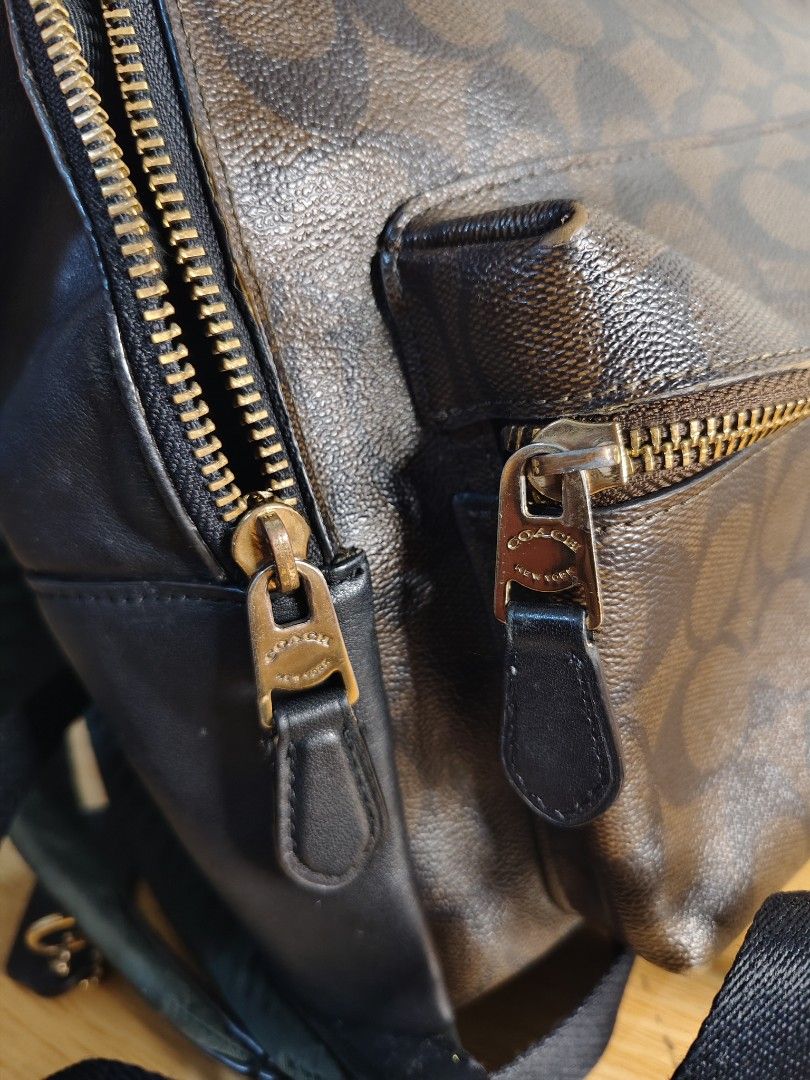Coach Signature Monogram Backpack Brown Black (Category: Backpacks) located in Cebu City. Submitted by danilobata87944 (Listing ID 1462982026, Image 3). Description: - Authentic Coach backpack in signature brown and black monogram print. - Features a convenient front zip pocket with the Coach logo. - Stylish gold hardware zippers. - Adjustable straps for a comfortable fit. - Ideal for everyday use or travel adventures..