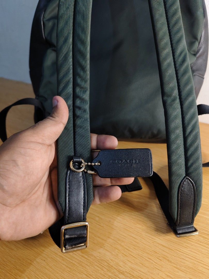 Coach Signature Monogram Backpack Brown Black (Category: Backpacks) located in Cebu City. Submitted by danilobata87944 (Listing ID 1462982026, Image 2). Description: - Authentic Coach backpack in signature brown and black monogram print. - Features a convenient front zip pocket with the Coach logo. - Stylish gold hardware zippers. - Adjustable straps for a comfortable fit. - Ideal for everyday use or travel adventures..