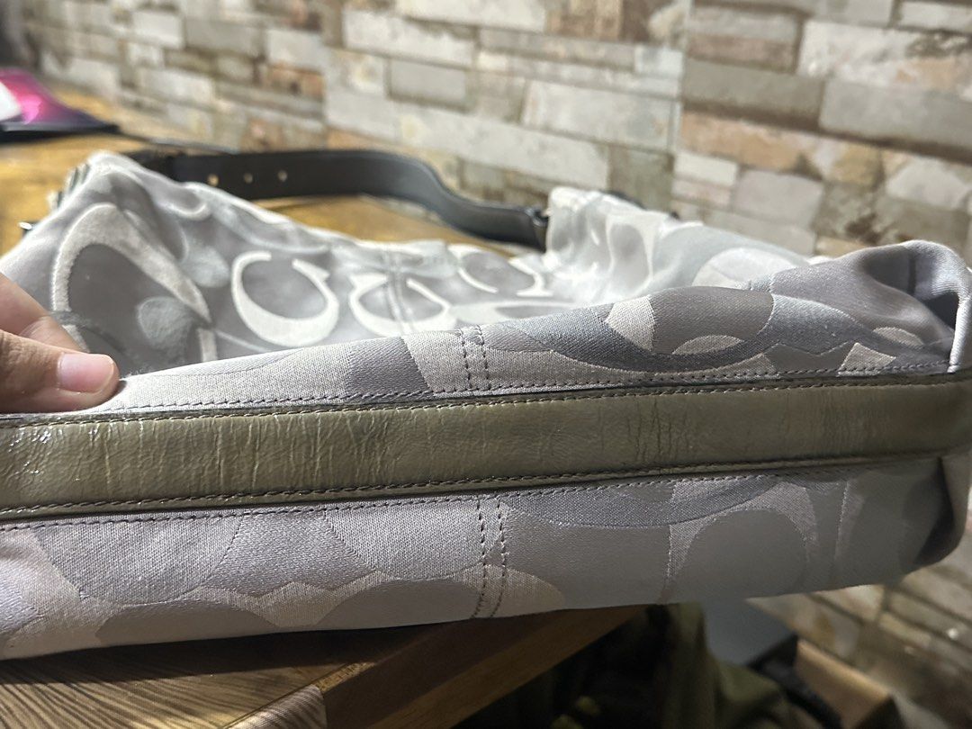 Coach Signature Monogram Shoulder Bag (Category: Luxury Bags & Wallets) located in Manila. Submitted by keiscart_ (Listing ID 1463008654, Image 3). Description: - Grey Coach monogram shoulder bag - Patent leather trim and strap - Silver hardware with turn-lock closure - Spacious interior, ideal for everyday use.