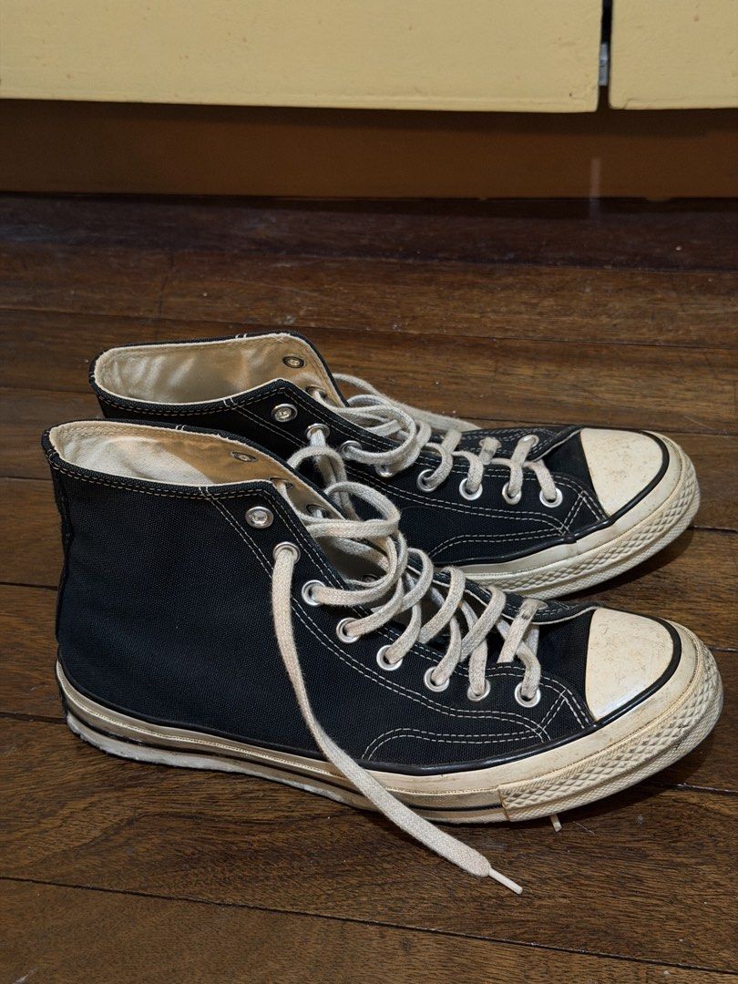 Converse 70s High (Category: Sneakers) located in Manila. Submitted by giotamayo04 (Listing ID 1462896479, Image 1). Description: Classic black Converse high tops. These are the 70s model, known for their vintage look and feel. They have the signature rubber toe cap and white laces. The canvas upper is black. Soles are off-white and show some signs of wear. Great for everyday wear..