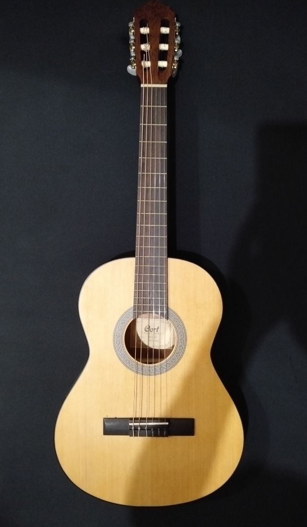 Cort AC70F Acoustic Guitar (Category: Musical Instruments) located in Paranaque City. Submitted by mybay.ph (Listing ID 1463010437, Image 1). Description: - ₱8,750.00 Original Price - Natural Wood Finish - Ideal for Beginners - Plays Smoothly - Ready for a New Owner The traditional style AC models have been re-engineered to improve resonance for an authentic classical guitar sound. The nice combination of tone-woods yields a traditional, deep and
