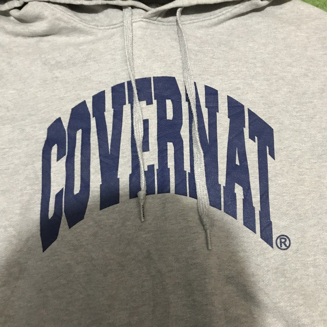 COVENANT Grey Hoodie with Blue Logo (Category: Hoodies) located in Polomolok. Submitted by paollette1214 (Listing ID 1463039797, Image 2). Description: - Grey hoodie from COVENANT - Features 'COVENANT' blue arched logo on the front - Includes a front pocket and a hood - Small embroidered logo detail on the sleeve - Ideal for everyday casual wear.