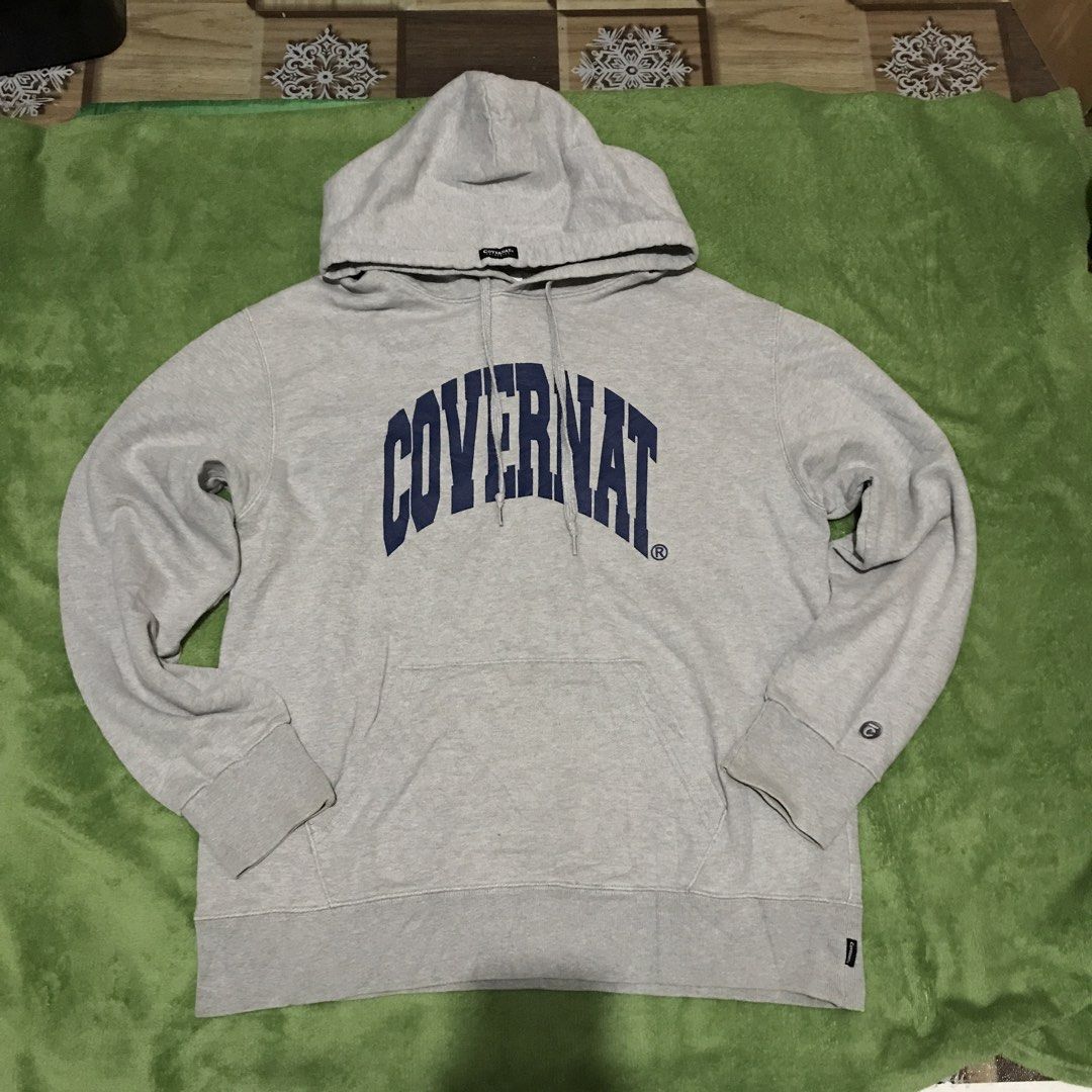 COVENANT Grey Hoodie with Blue Logo (Category: Hoodies) located in Polomolok. Submitted by paollette1214 (Listing ID 1463039797, Image 1). Description: - Grey hoodie from COVENANT - Features 'COVENANT' blue arched logo on the front - Includes a front pocket and a hood - Small embroidered logo detail on the sleeve - Ideal for everyday casual wear.