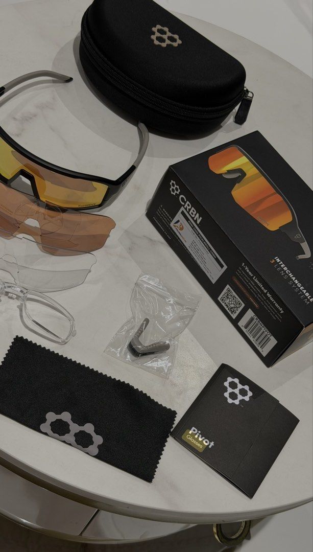 CRBN Pivot Interchangeable Lens System Sunglasses (Category: Sunglasses & Eyewear) located in Quezon City. Submitted by LovedByAna_ (Listing ID 1463036110, Image 2). Description: - CRBN Pivot sunglasses with interchangeable lens system - Includes yellow, brown, and clear lenses - Comes with protective case, cleaning cloth, and extra nose piece - Ideal for various sports and outdoor activities - Original box and manual included.