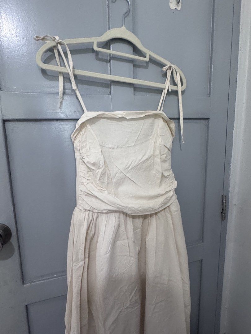 CREAM LONG TIE STRAP DRESS (Category: Dresses) located in Makati City. Submitted by sassywear.ph (Listing ID 1463016898, Image 2). Description: Can fit small-medium, like new condition. .