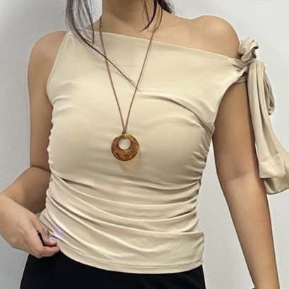 Cream One Shoulder Ruched Tie Top (Category: Sleeveless) located in Quezon City. Submitted by gg.finds (Listing ID 1462942998, Image 1). Description: - new, only worn once for an event - double lining, comfy fabric material - one shoulder tie top, ruched, stretchable - size fits Small to Medium - color is Cream / Beige - rfs: decluttering.