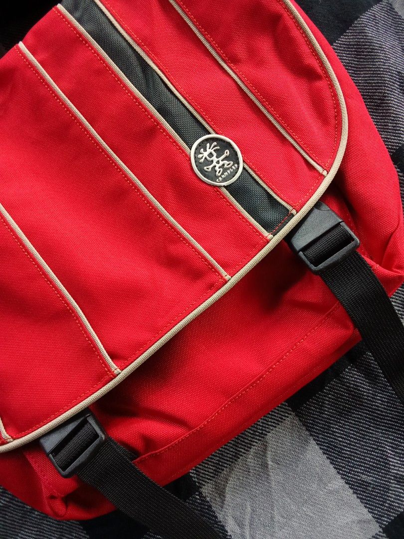 Crumpler Red Messenger Bag (Category: Sling Bags) located in Manila. Submitted by timog_high_ice_v2 (Listing ID 1463115518, Image 2). Description: - Red Crumpler messenger bag - Main compartment - Front zip pocket - Two black velcro circles on the front - Adjustable strap - Great for everyday use.