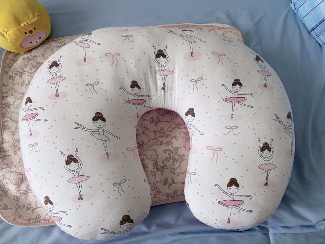Cute Ballerina Nursing Pillow (Category: Breastfeeding & Bottle Feeding) located in Manila. Submitted by cjoy.cjoy (Listing ID 1462923001, Image 1). Description: - White nursing pillow with adorable ballerina pattern - Features charming pink and grey accents - Inner lining showcases a delightful woodland animal print - Ideal for comfortable feeding sessions - Also great for relaxing and lounging - Made with soft, comfortable materials.