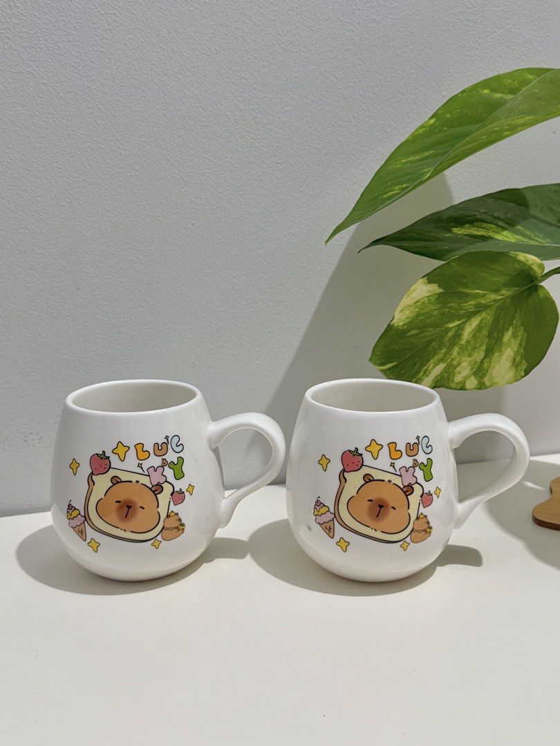 Cute Bear Toast Mug Set (Category: Coffee & Tea Tableware) located in Makati City. Submitted by ariannelaz54133 (Listing ID 1462927433, Image 1). Description: - Set of 2 adorable mugs - Features cute kawaii bear design with toast and strawberries - Made of white ceramic - Ideal for morning coffee or tea - Great for gifting or personal use.