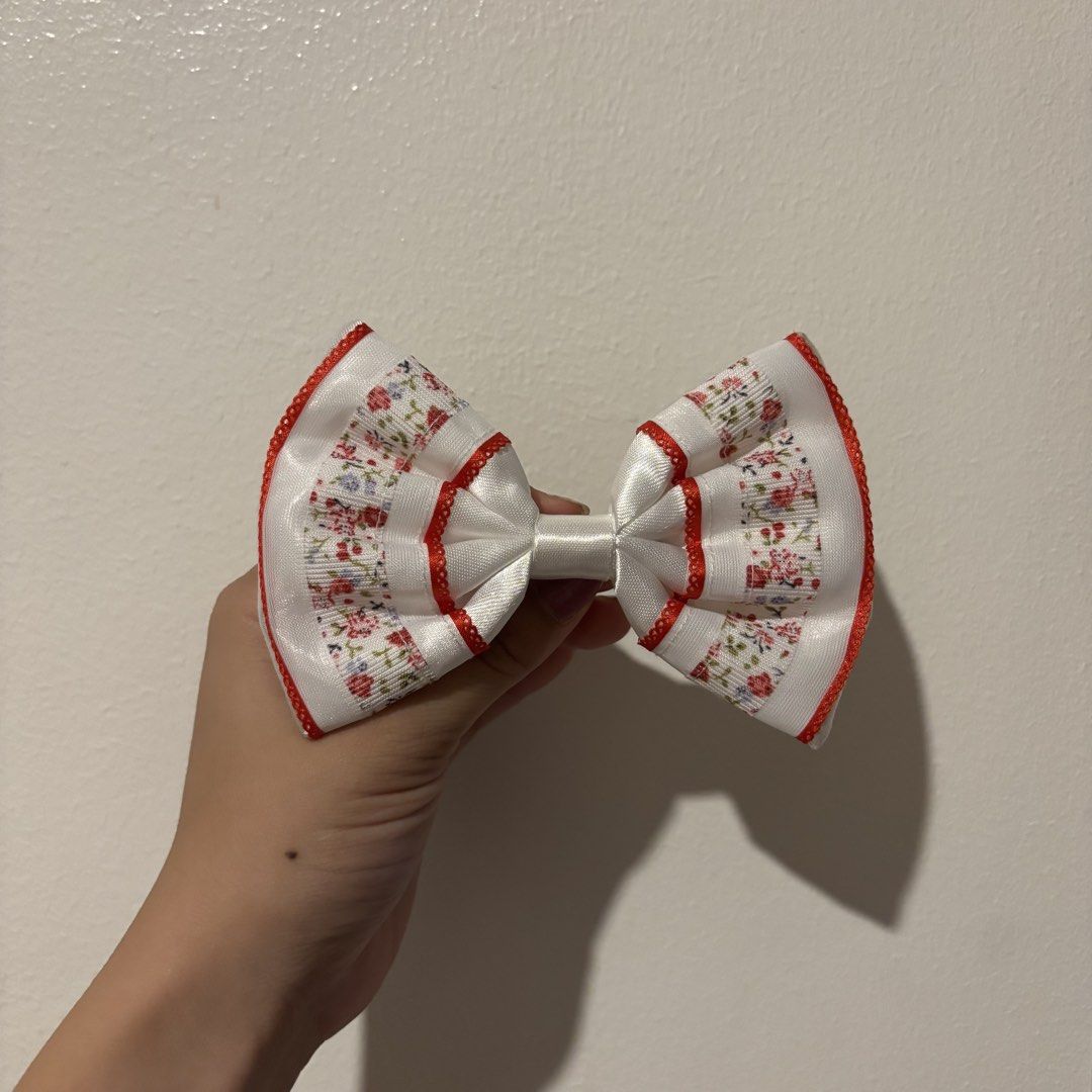 Cute Hair Clips & Bows Set - Various Designs (Category: Hair Accessories) located in Manila. Submitted by robbyrabbit (Listing ID 1462922509, Image 1). Description: - Set of cute hair accessories perfect for kids or anyone who loves adorable styles. - Includes floral bows with red, grey, and blue trim. - Features two pink cloud-shaped snap clips with My Melody. - Comes with two dusty rose flower clips and a matching bow..