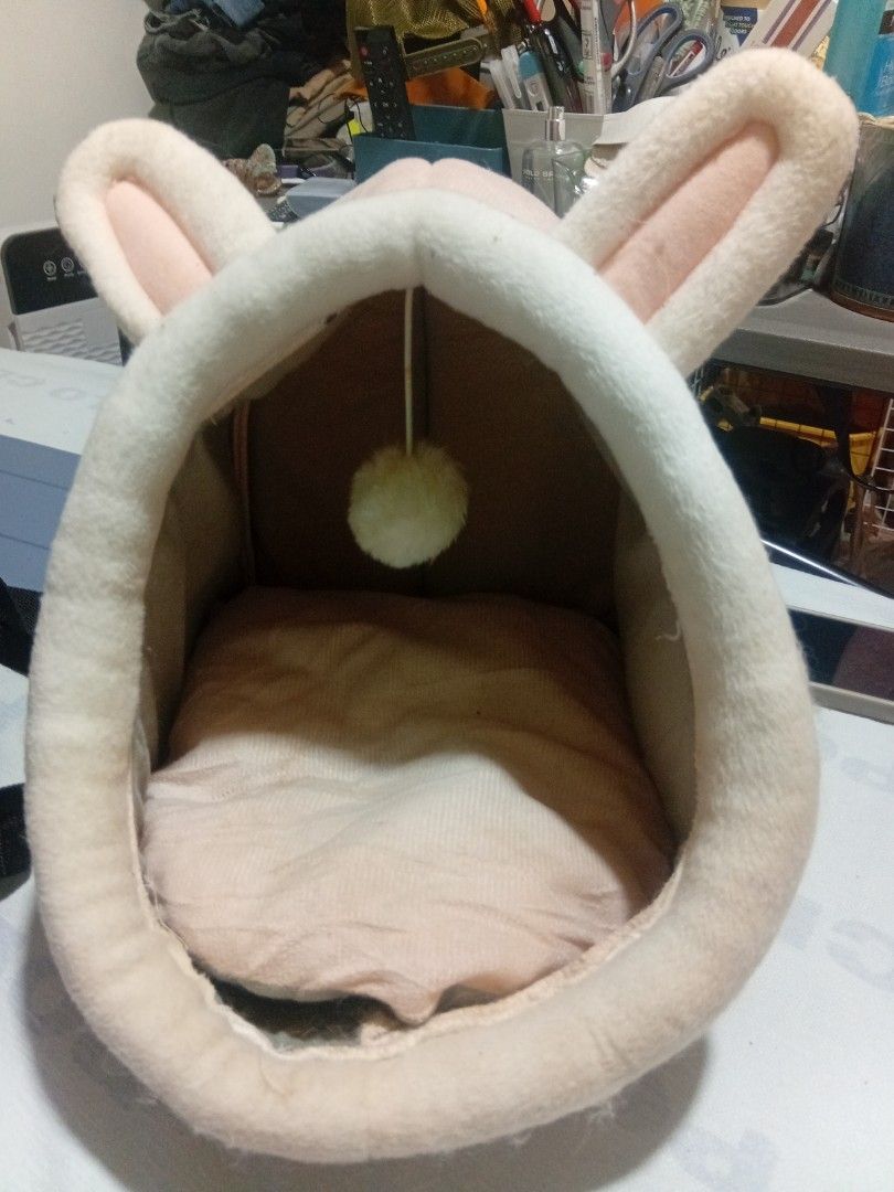 Cute Pink Bunny Ear Pet Bed (Category: Homes & Other Pet Accessories) located in Las Pinas. Submitted by jaziyah6 (Listing ID 1462941322, Image 1). Description: - Super soft and cozy pet bed - Adorable bunny shape with cute ears - Includes a little pom-pom toy inside - Perfect for small pets to snuggle - Sweet pink and white color scheme - Easy to clean.