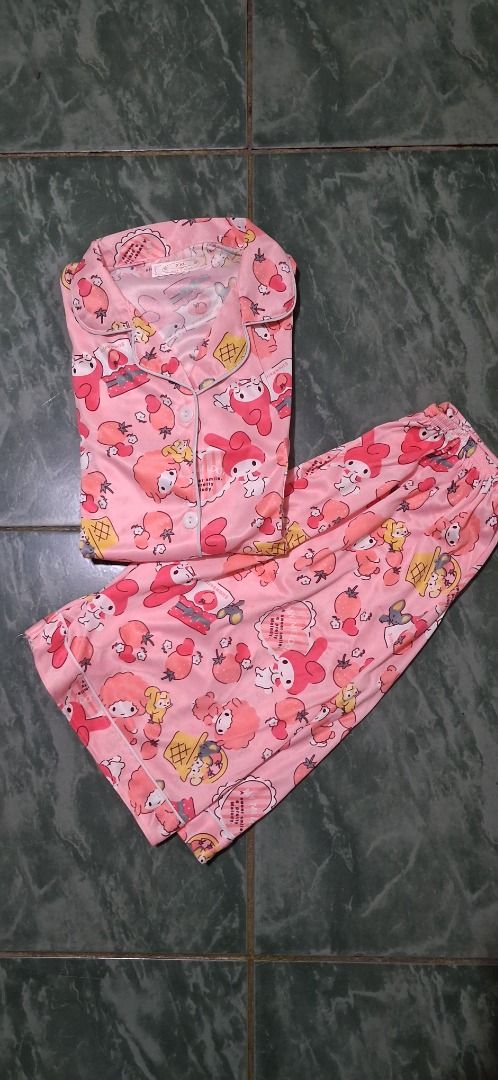 Cute Pink My Melody Pajama Set (Category: Undergarments & Loungewear) located in Manila. Submitted by katkween23 (Listing ID 1462895802, Image 2). Description: - Adorable pink pajama set featuring a fun all-over My Melody print. - Includes a comfortable button-up top with short sleeves. - Comes with matching pajama pants. - Made from soft and silky fabric for ultimate comfort. - Ideal for lounging at home or for a cozy night's sleep. - A perfect 