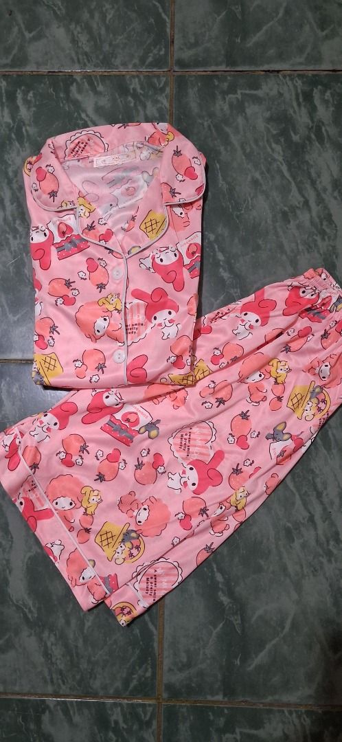 Cute Pink My Melody Pajama Set (Category: Undergarments & Loungewear) located in Manila. Submitted by katkween23 (Listing ID 1462895802, Image 3). Description: - Adorable pink pajama set featuring a fun all-over My Melody print. - Includes a comfortable button-up top with short sleeves. - Comes with matching pajama pants. - Made from soft and silky fabric for ultimate comfort. - Ideal for lounging at home or for a cozy night's sleep. - A perfect 