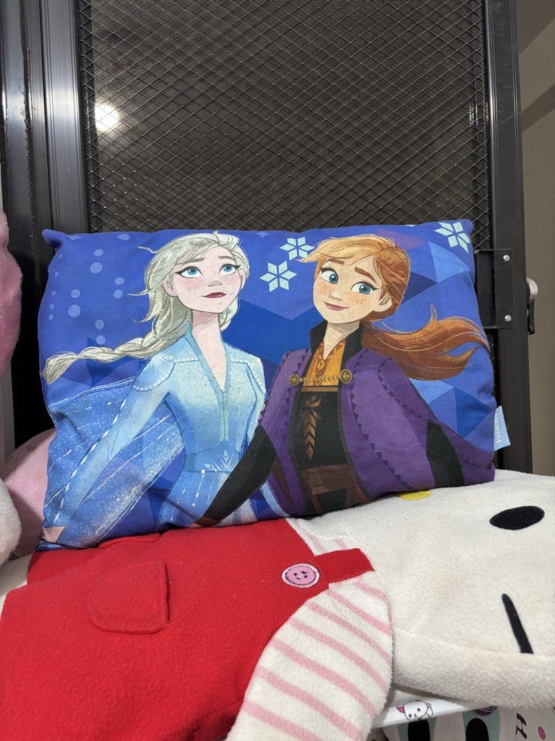 Cute Plush Pillows - Bear, Frozen, Flower (Category: Plushies & Soft Toys) located in Manila. Submitted by robbyrabbit (Listing ID 1462921580, Image 2). Description: - Bundle of 3 cute plush pillows - Includes a long pink pillow with a purple bear face - Rectangular pillow featuring Elsa and Anna from Frozen - Soft flower-shaped pillow in pink and yellow - Perfect for decoration or cuddling - All items are clean and well-kept.