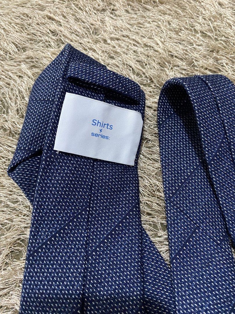 Dark Blue Patterned Tie (Category: Ties) located in Bulacan. Submitted by rich2545 (Listing ID 1462902860, Image 3). Description: - Dark blue tie - Subtle white pattern - From the 'Shirts x series' collection (likely) - Suitable for formal or smart casual wear - Please check photos for complete appearance.