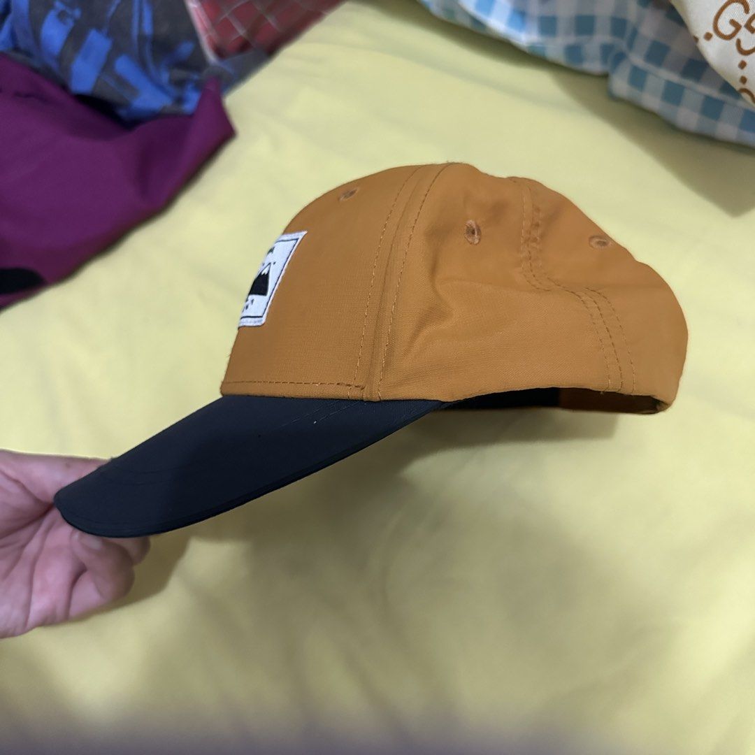 Decathlon Quechua Cap (Category: Caps & Hats) located in Kawit. Submitted by wevibevintage (Listing ID 1463043318, Image 3). Description: - Orange cap with a classic black brim. - Features a 'Quechua Night Camp' embroidered patch on the front. - Ideal for outdoor activities like camping and hiking. - Also great for casual, everyday wear. - Provides sun protection on bright days. - Simple, stylish, and versatile design..