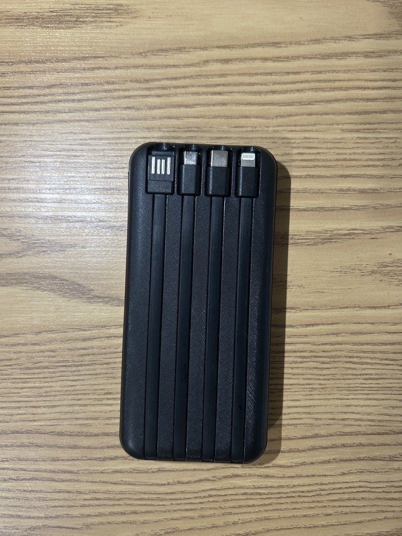 Deejays 10,000mAh Power Bank (Category: Batteries & Power Banks) located in Manila. Submitted by zealpenguin-a0aa (Listing ID 1463118928, Image 2). Description: Selling my Deejays 10,000mAh power bank. Still in good condition and working properly. It has built-in cables for iPhone/Lightning, Type-C, Micro USB, and USB, plus wireless charging. Dm if interested..