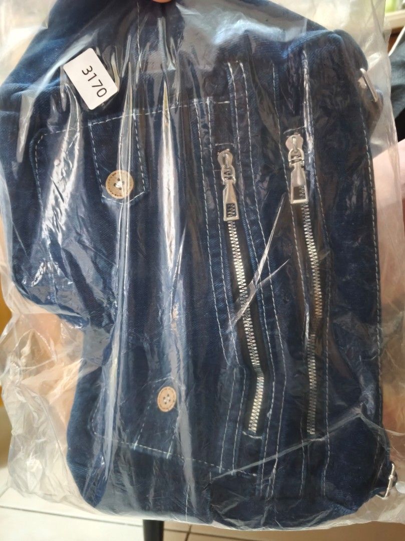 Denim Bag with Multiple Zippers (Category: Shoulder Bags) located in Taguig. Submitted by deyerreC2020 (Listing ID 1462929303, Image 2). Description: brand new bag denim fabric Cool dark wash denim shoulder bag with adjustable strap. Features multiple zipper pockets, button details, and side pockets for essentials. Perfect for everyday. medium size bag MOP: gcash/Maya / cash.