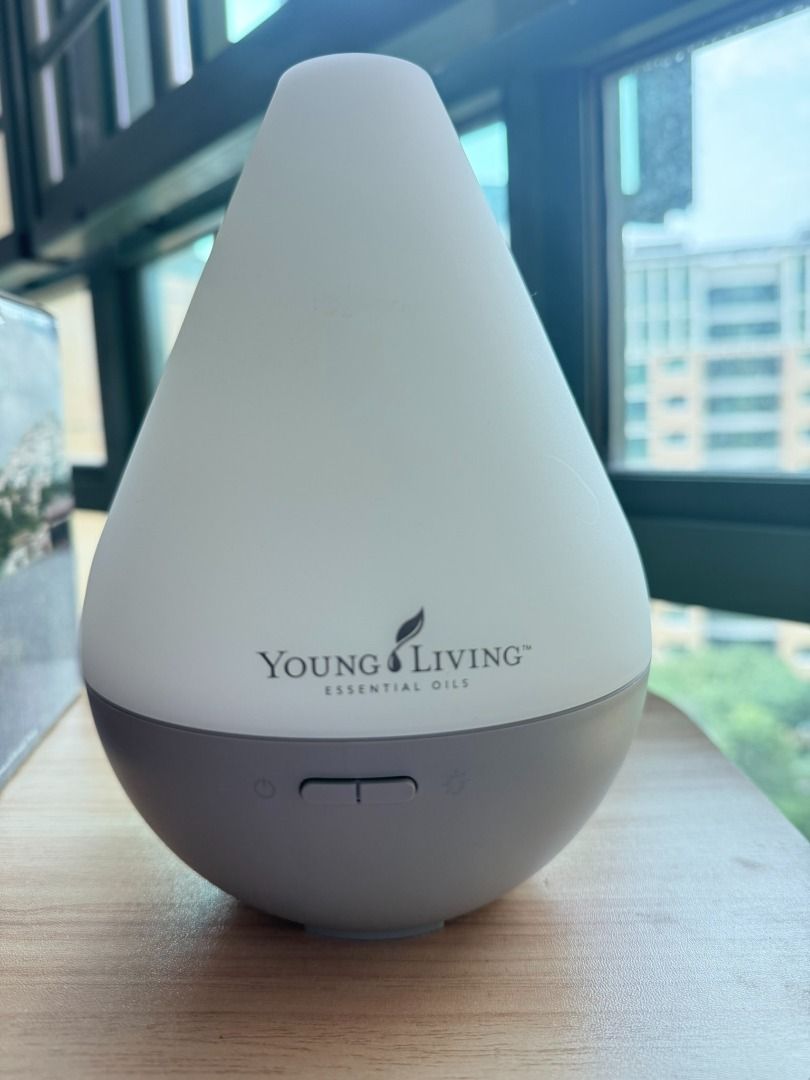 Dewdrop Diffuser (Category: Home Fragrance) located in Singapore. Submitted by rockz889 (Listing ID 1462998177, Image 2). Description: Dimensions: 135 x 135 x 190mm Young Living’s Dewdrop™ Diffuser functions as a humidifier, atomizer, and aroma diffuser in one simple-to-use product. Its ultrasonic technology breaks any mixture of essential oils and water into millions of microparticles, disperses them into the air, and releases the constituents f