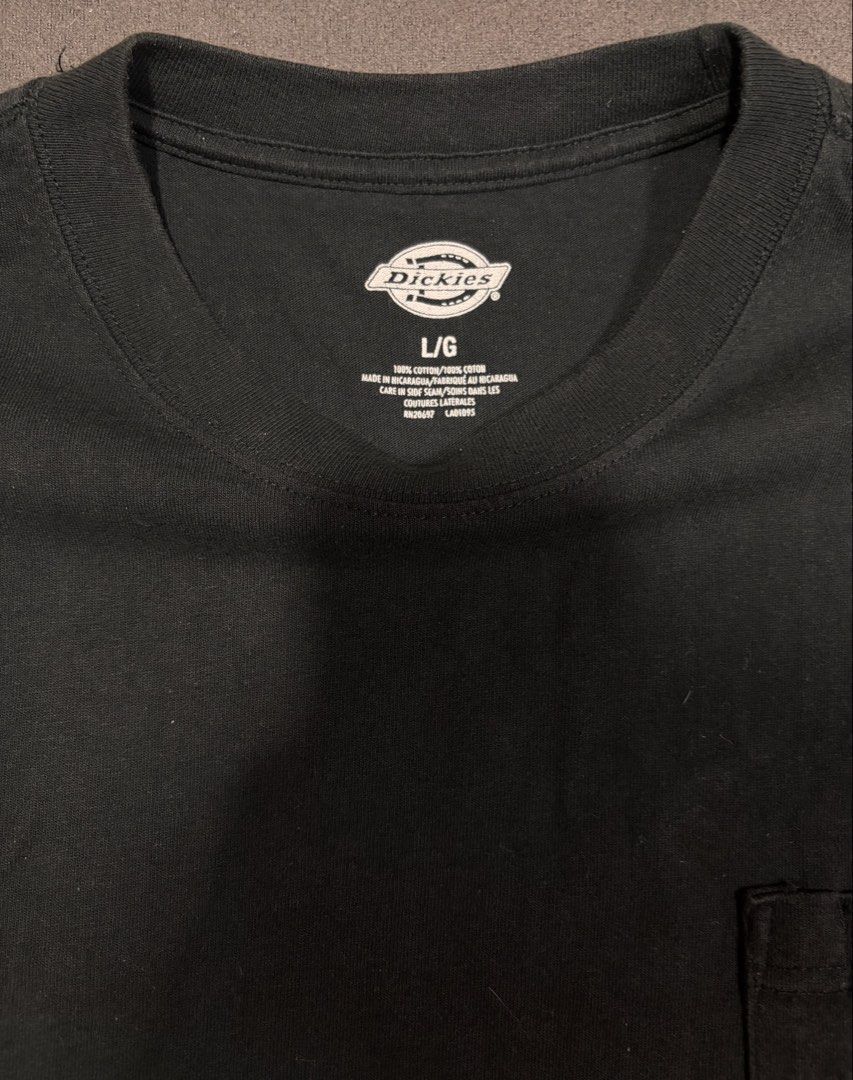 Dickies Black Pocket T-Shirt Size L (Category: Tshirts & Polo Shirts ) located in Mabalacat. Submitted by _limitlessfashion (Listing ID 1462900929, Image 3). Description: - Classic black Dickies pocket tee - Size: Large (L) - Length 30 - Widths 23 - Color rate & condition 9.5/10 - No major issue - Material: 100% Cotton - Features: Chest pocket - Style: Essential, durable, and versatile for everyday wear - Perfect for: Easy pairing with any outfit