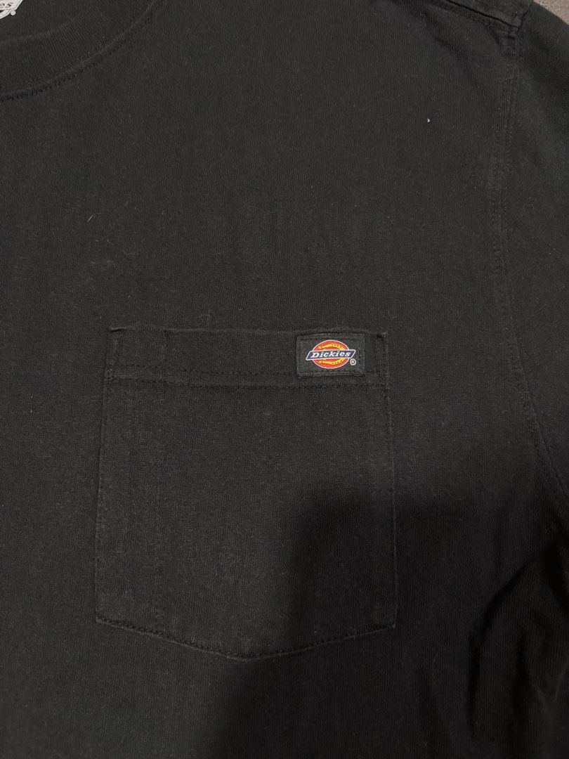 Dickies Black Pocket T-Shirt Size L (Category: Tshirts & Polo Shirts ) located in Mabalacat. Submitted by _limitlessfashion (Listing ID 1462900929, Image 2). Description: - Classic black Dickies pocket tee - Size: Large (L) - Length 30 - Widths 23 - Color rate & condition 9.5/10 - No major issue - Material: 100% Cotton - Features: Chest pocket - Style: Essential, durable, and versatile for everyday wear - Perfect for: Easy pairing with any outfit