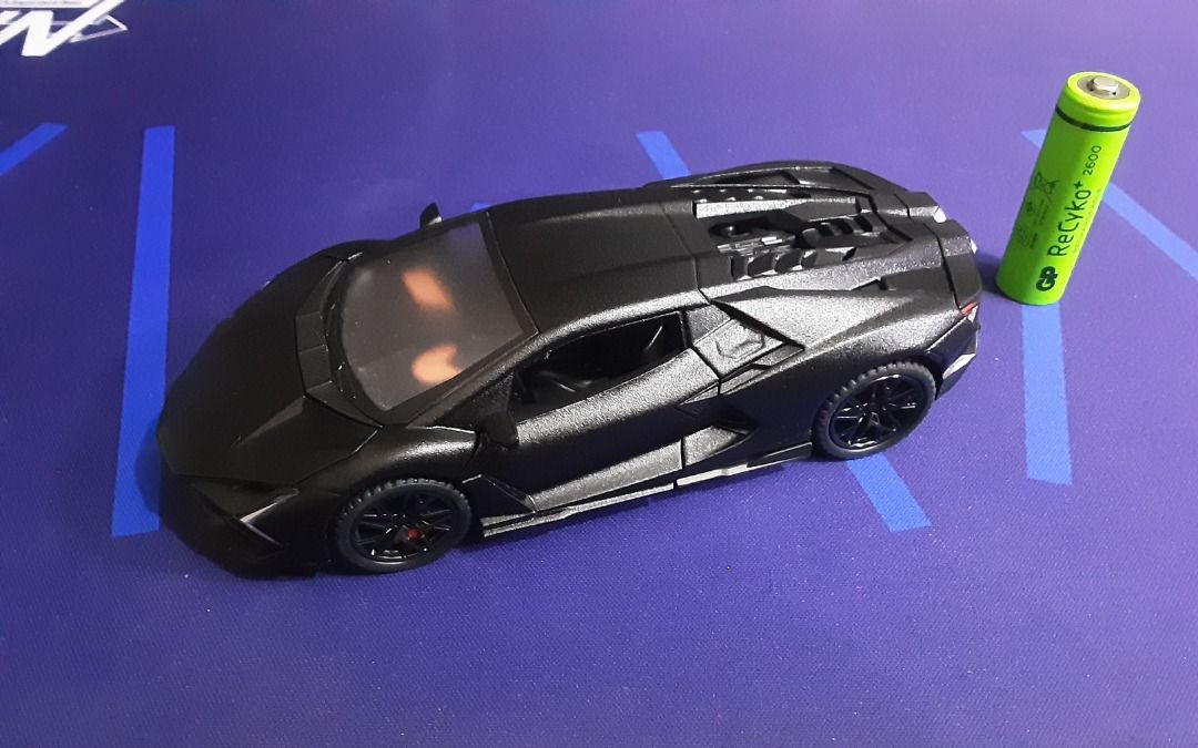Diecast Hypercar/Supercar Set - 1/32 Scale (Category: Vehicle & Diecast Models) located in Quezon City. Submitted by bobbyrey1 (Listing ID 1462945467, Image 2). Description: Diecast Hypercar/Supercar Set - 1/32 Scale In 1/32 Scale (but mas malaki nang konti sa standard na 1/32) Set of 4. Lamborghini Revuelto (Electronic, with working lights and sound) Lamborghini V12 Vision GT (Electronic, with working lights and sound) Apollo EVO (Electronic, wi