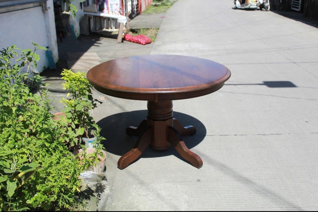 Dining table (Category: Tables & Sets) located in Meycauayan. Submitted by marygracecasimiro (Listing ID 1462998460, Image 3). Description: Solid Wood Round Pedestal Table Vintage round wooden pedestal table with a thick solid wood top, turned central column and sturdy four-legged base. Perfect as a coffee table, side table or foyer accent piece L:42 ¼ • W:42 ¼ • H:27 ½ inches 11,900 pesos only💜💜.