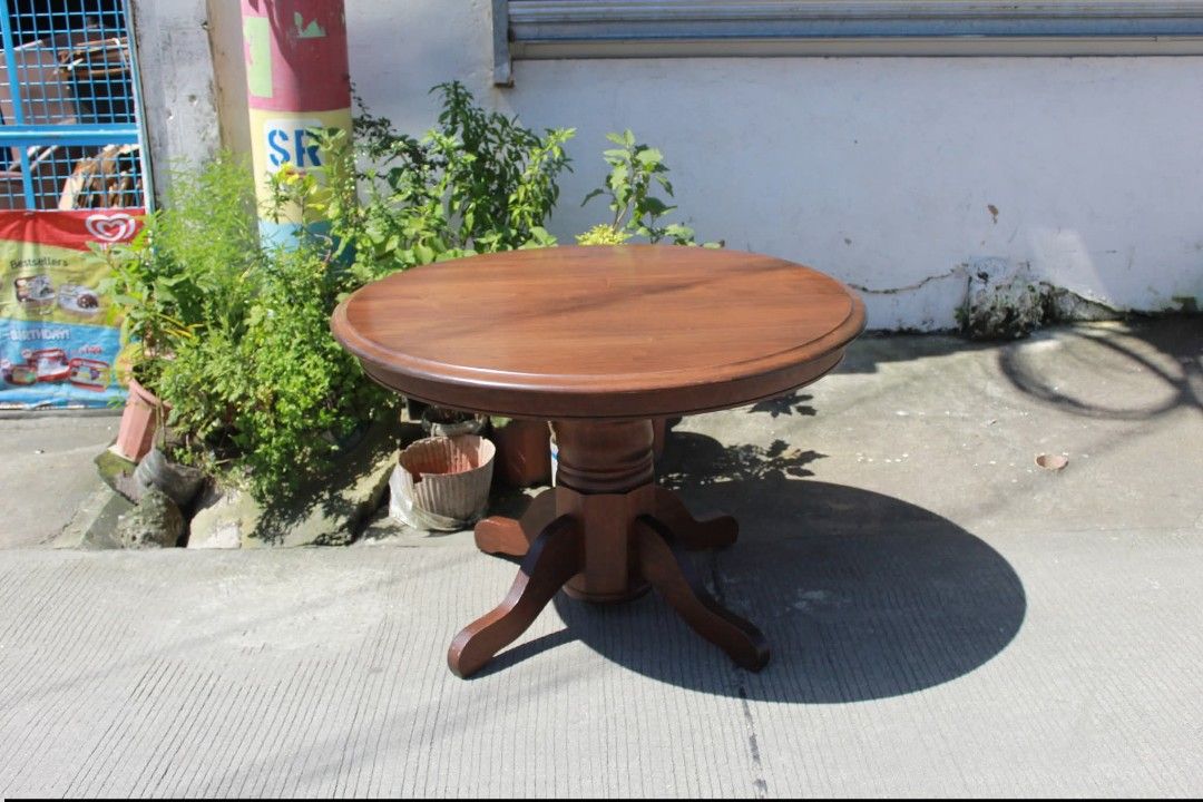 Dining table (Category: Tables & Sets) located in Meycauayan. Submitted by marygracecasimiro (Listing ID 1462998460, Image 1). Description: Solid Wood Round Pedestal Table Vintage round wooden pedestal table with a thick solid wood top, turned central column and sturdy four-legged base. Perfect as a coffee table, side table or foyer accent piece L:42 ¼ • W:42 ¼ • H:27 ½ inches 11,900 pesos only💜💜.