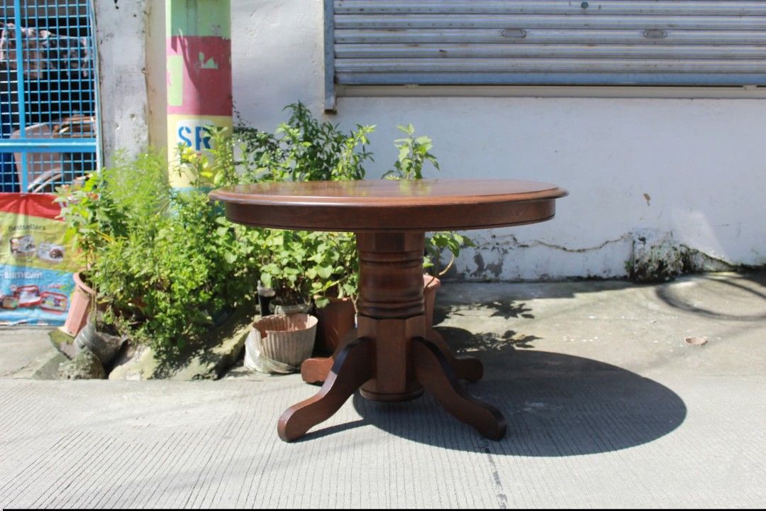 Dining table (Category: Tables & Sets) located in Meycauayan. Submitted by marygracecasimiro (Listing ID 1462998460, Image 2). Description: Solid Wood Round Pedestal Table Vintage round wooden pedestal table with a thick solid wood top, turned central column and sturdy four-legged base. Perfect as a coffee table, side table or foyer accent piece L:42 ¼ • W:42 ¼ • H:27 ½ inches 11,900 pesos only💜💜.