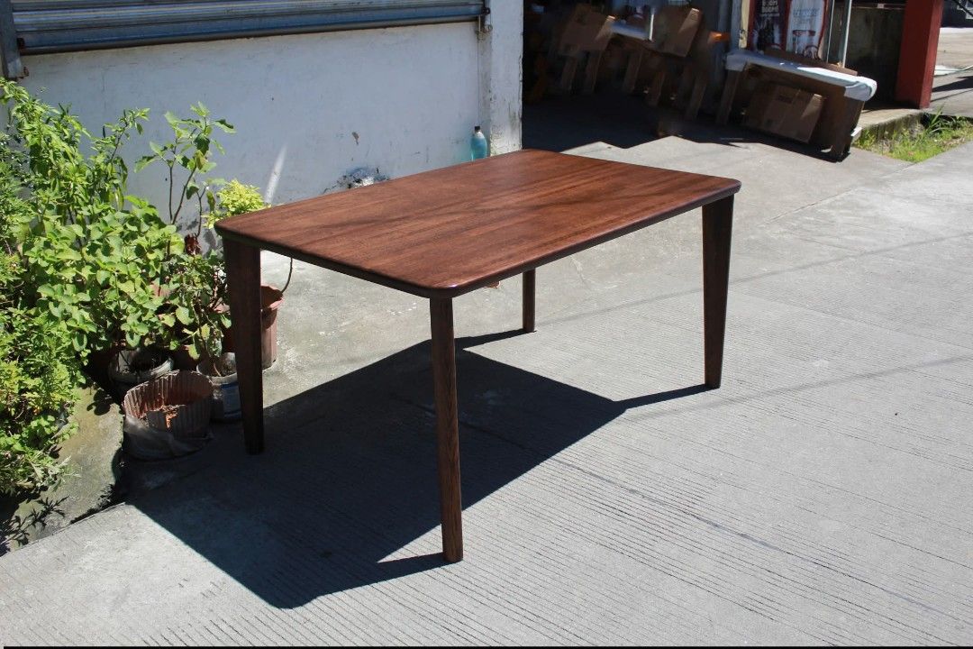 Dining Table (Category: Tables & Sets) located in Meycauayan. Submitted by marygracecasimiro (Listing ID 1463009104, Image 3). Description: CHITANO Mid-Century Modern Dining Table Premium solid wood rectangular dining table with rounded corners, a rich dark wood finish and slim tapered legs. Its clean, elegant design is perfect for dining areas, modern homes or minimalist interiors L:53 ¼ • W:34 ¾ • H:27 ¼ inches 8,700 pesos only💚.