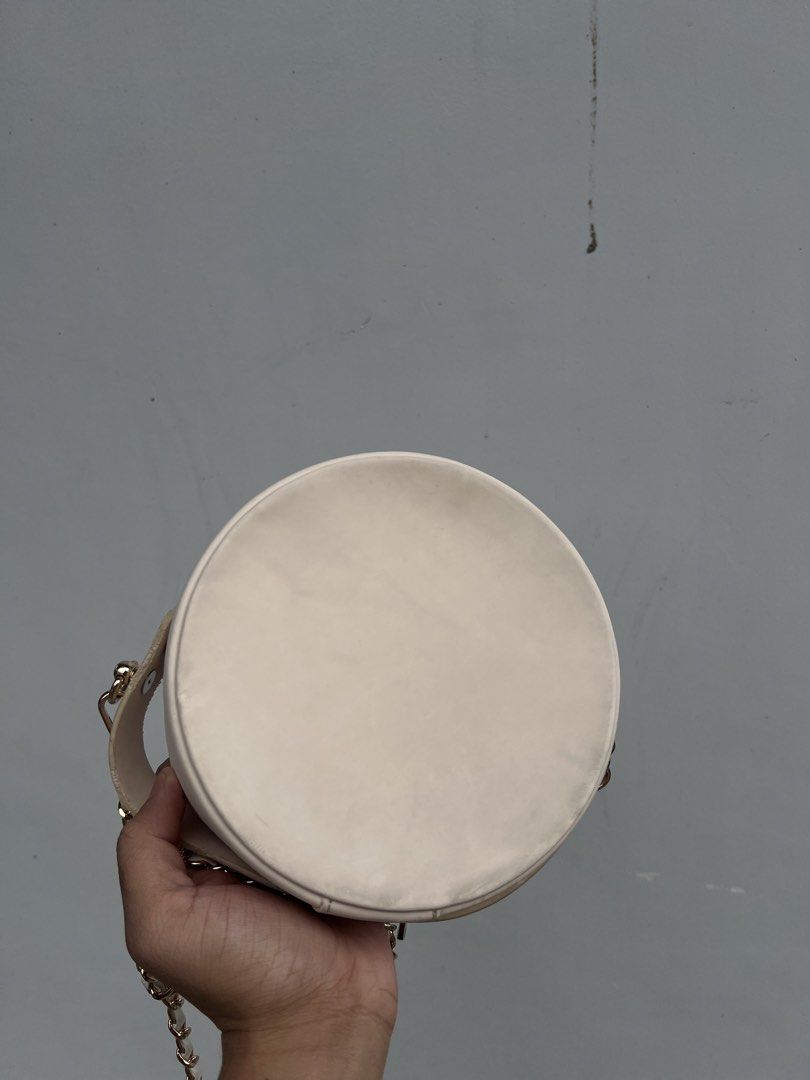 Dior Round Vanity Bag in Cream/Offwhite (Category: Luxury Bags & Wallets) located in Baguio. Submitted by bagsbags2600 (Listing ID 1463061165, Image 3). Description: Good Condition Authentic Has minor dirt and removable stains No Hardware issue Has yellow stain behind the front panel Has a price mark also Minor Deform Inside. 3200 Shipped Baguio Loc.