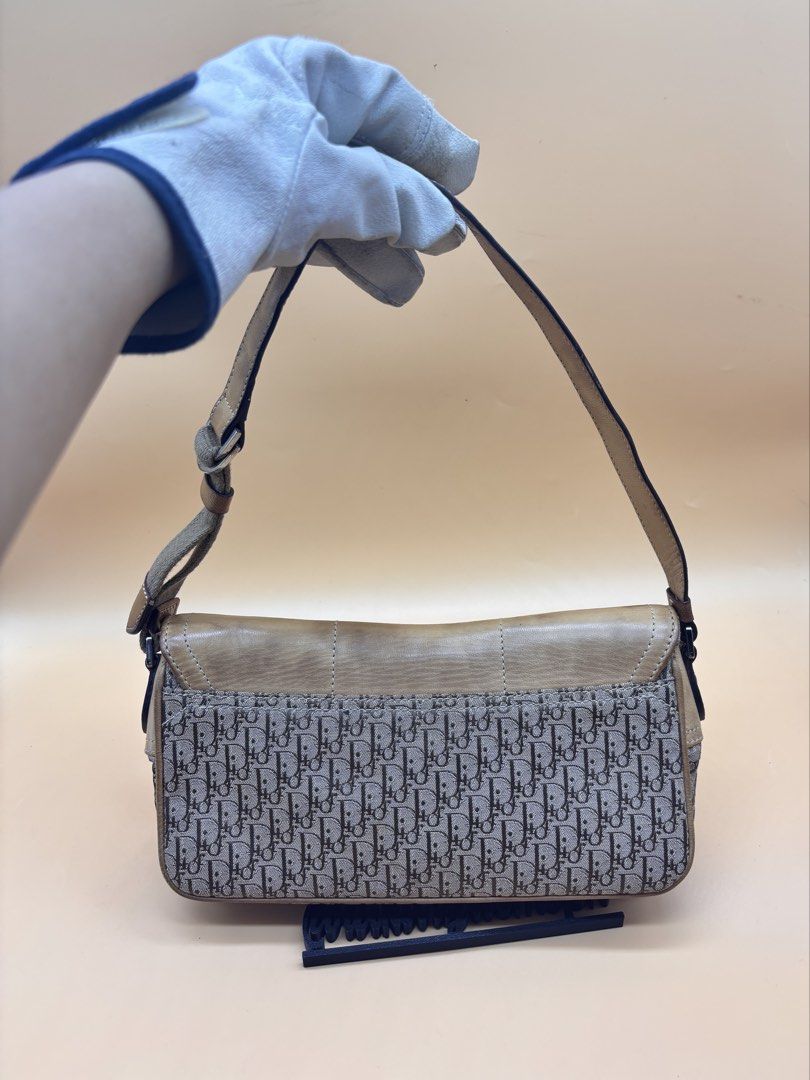 Dior Street Chic Monogram Shoulder Bag (Category: Luxury Bags & Wallets) located in Pamplona. Submitted by luxuryitems_ph (Listing ID 1462991762, Image 2). Description: - Authentic Dior shoulder bag - Classic Dior monogram pattern - Tan leather accents - Front zipper pocket - Adjustable strap - Perfect for everyday style - Shows some signs of wear on the leather.