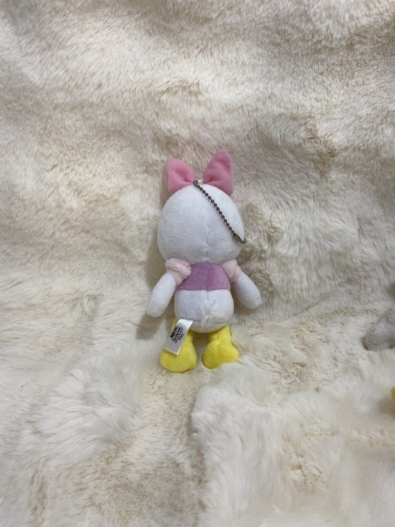 Disney Daisy Duck Plush charm (Category: Plushies & Soft Toys) located in Kalibo. Submitted by ollie_stuffshop (Listing ID 1462897540, Image 2). Description: Before you send your inquiries: ❗️Last Price is already posted ❗️Manage your expectations, WYSIWYG ❗️May need washing ❗️Dropoff is every Wednesday & Sunday - Adorable Daisy Duck plush toy - Features a cute pink bow and pink top - Classic yellow feet and beak - Includes a metal keychain loop 