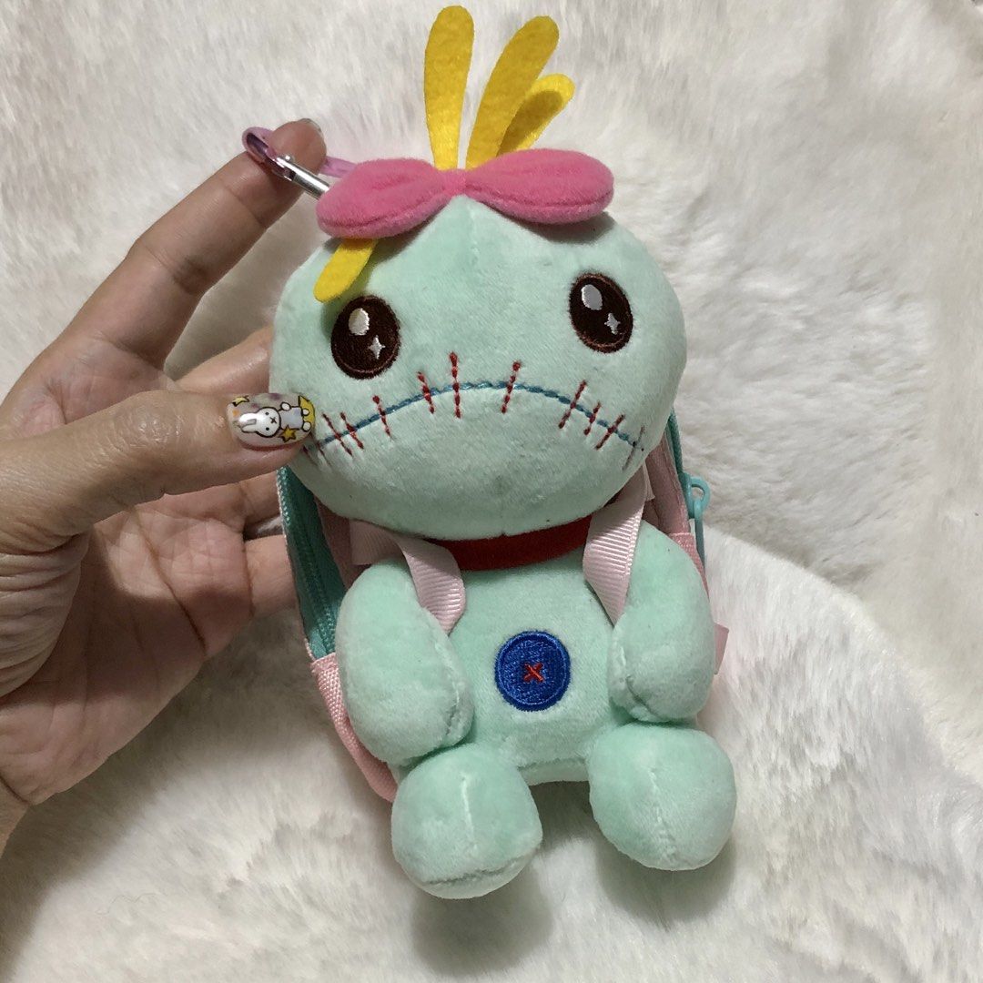 Disney Stitch Scrump Mini Backpack Pouch Charm (Category: Plushies & Soft Toys) located in Quezon City. Submitted by kitsune.treasures (Listing ID 1462943833, Image 2). Description: *First to pay policy! *1 day reservation only. Failure to pay on time, auto cancel. 📍Quezon City * MOD: J&T | Lalamove * MOP: GCASH | BPI 📦ON HAND AND READY TO SHIP! CONDITION: WHAT YOU SEE IS WHAT YOU GET. Dimensions: Kindly check the photos for the actual measurem