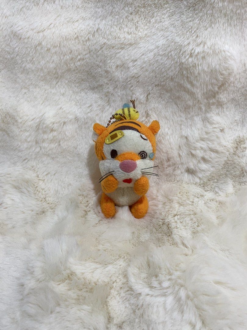 Disney Tigger Bee Sting Plush Charm Keychain (Category: Plushies & Soft Toys) located in Kalibo. Submitted by ollie_stuffshop (Listing ID 1462902683, Image 1). Description: Before you send your inquiries: ❗️Last Price is already posted ❗️Manage your expectations, WYSIWYG ❗️May need washing ❗️Dropoff is every Wednesday & Sunday - Adorable Tsum Tsum Tigger plush keychain - Features a cute bee detail on Tigger's head - Includes a durable metal chain