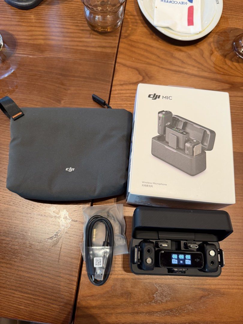 DJI Mic Wireless Microphone System with Charging Case (Category: Microphones) located in Manila. Submitted by ranulfovpayos.jr (Listing ID 1462967297, Image 2). Description: - DJI Mic wireless microphone system - Includes 2 transmitters and 1 receiver - Charging case displays battery life for each component - Comes with a storage pouch and charging cable - All original packaging included - Ideal for content creators.
