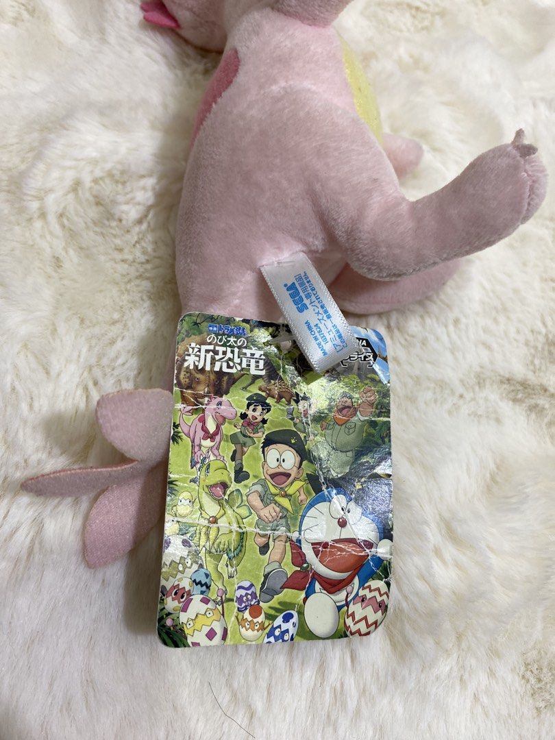 Doraemon “Myu” New Dinosaur SEGA Plush charm keychain (Category: Plushies & Soft Toys) located in Kalibo. Submitted by ollie_stuffshop (Listing ID 1463047101, Image 3). Description: Before you send your inquiries: ❗️Last Price is already posted ❗️Manage your expectations, WYSIWYG ❗️May need washing ❗️Dropoff is every Wednesday & Sunday - Adorable pink dinosaur plush toy - Features a cute heart shape on its side - Unique tail with three fins - Com