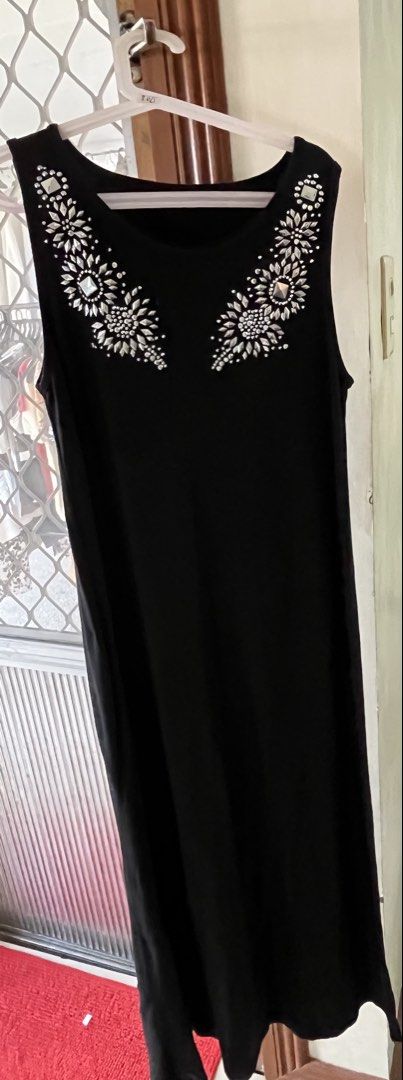 Dress black (Category: Dresses) located in Bacoor. Submitted by ayit. (Listing ID 1462984327, Image 1). Description: Strechable japn personal sf inc - Black dress - Japan brand - Size: Medium (fits UK 10 / US 6) - Condition: 4/5 - Features: Embellished neckline with silver details, sleeveless design - Perfect for casual or semi-formal occasions.