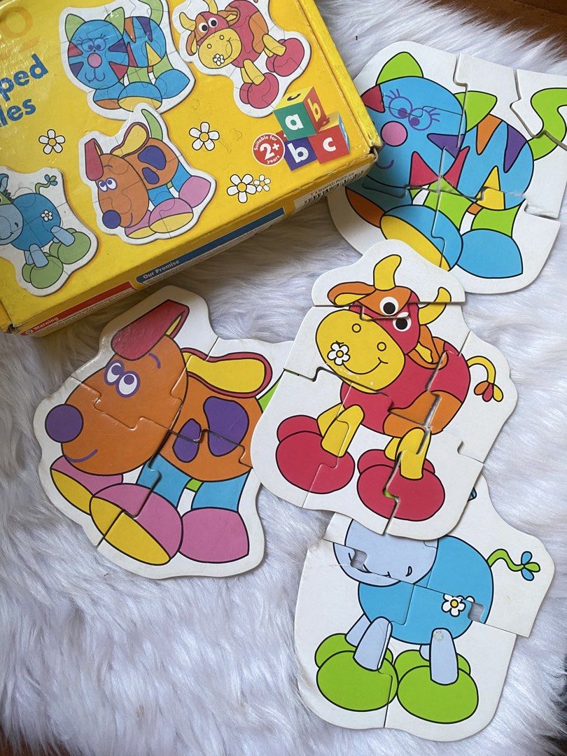 Early Learning Shaped Puzzles for Toddlers (Category: Board Games & Puzzles) located in Quezon City. Submitted by donagraceliwanag (Listing ID 1463035931, Image 1). Description: - Fun shaped jigsaw puzzles perfect for little ones. - Features colorful cartoon animals: cat, dog, cow, elephant. - Recommended for ages 2 years and up. - Helps develop motor skills and problem-solving abilities. - All puzzle pieces appear to be present..